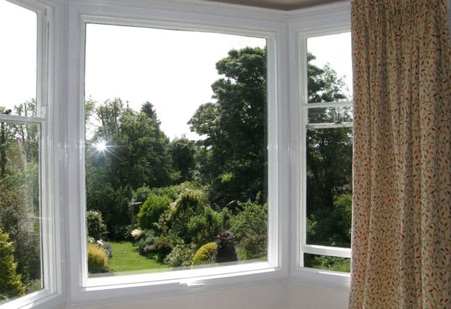 An uninterrupted garden view, and the secondary glazed units open easily for ventilation.