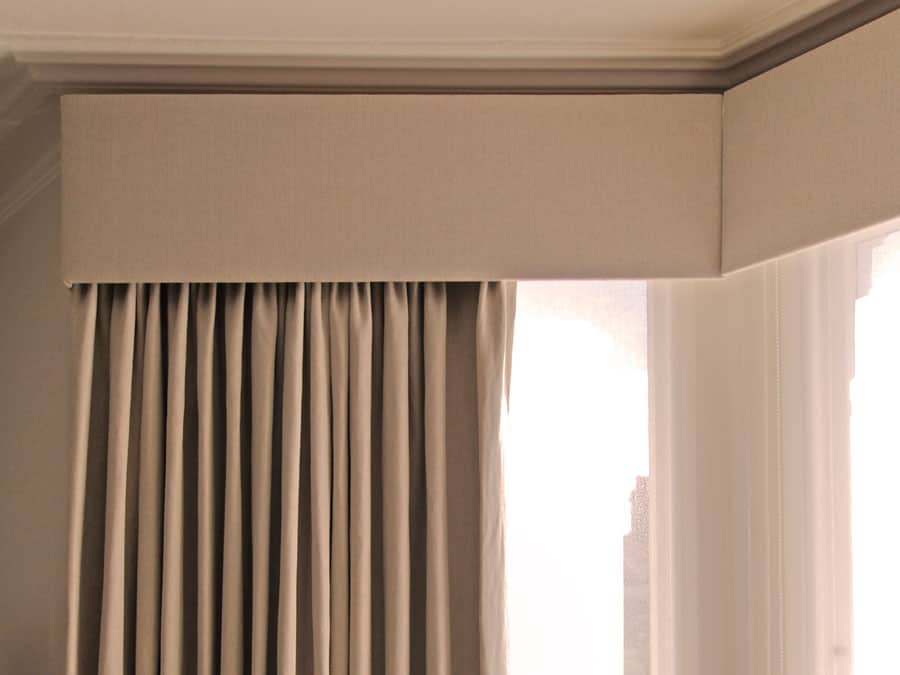 Hard pelmets over curtains keep the heat where you need it