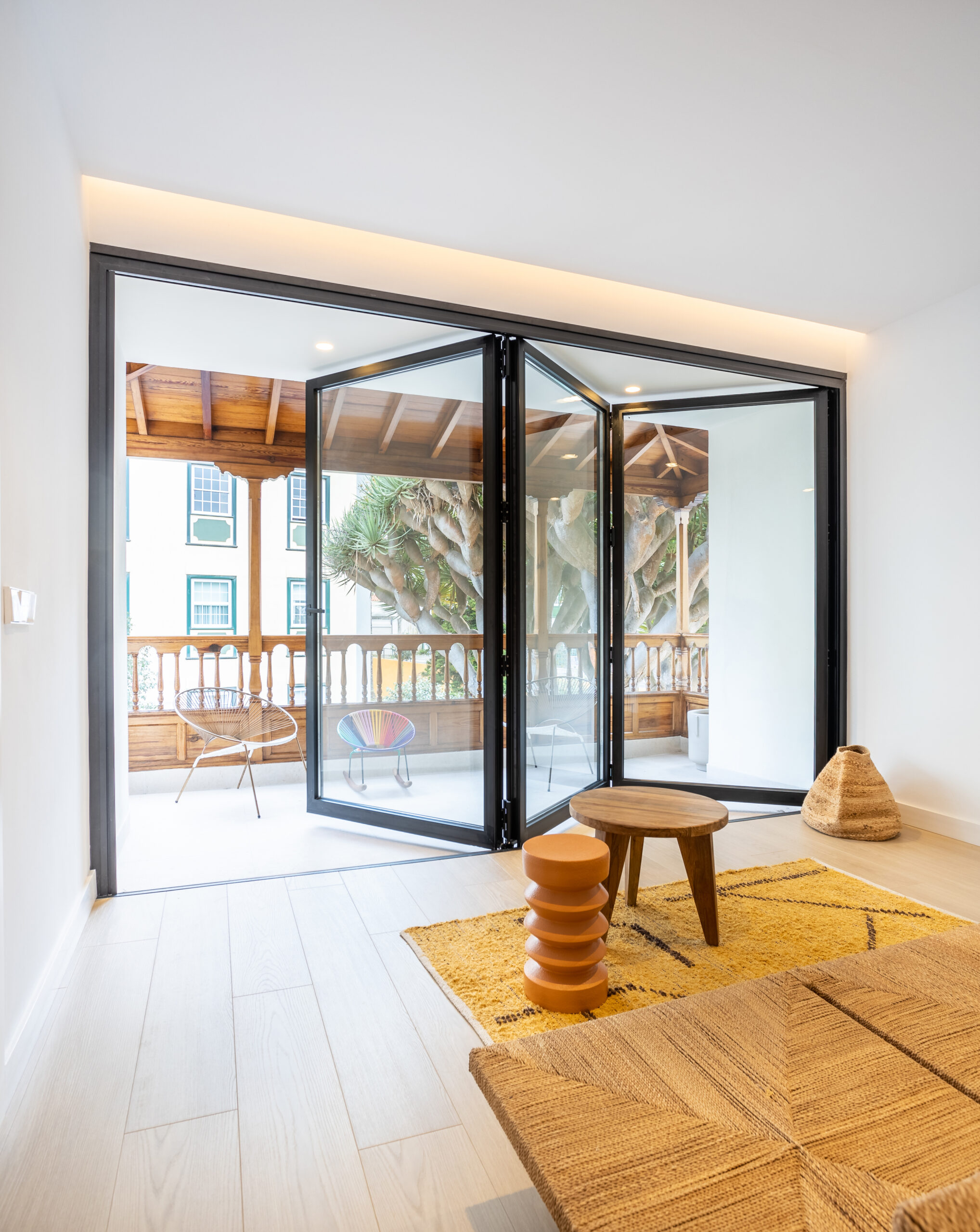 Clearview BiFold aluminium BiFold doors open in a bright room